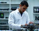 Technician with UAV in maintenance lab